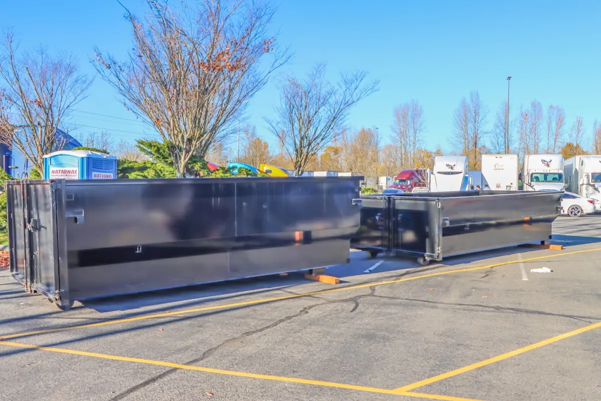 Professional dumpster rental service with roll-off container on residential driveway in Cartersville